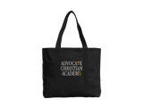 A black tote bag with black handles, featuring the text 'ADVOCATE CHRISTIAN ACADEMY' printed on the front in white and gold.