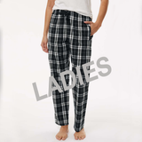 Black and white plaid pajama pants worn by a person on a white background with 'LADIES' text overlay.