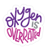 Dye cut motivational decal with 'Oxygen is Overrated' text in purple and pink on a white background