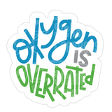 Dye cut motivational decal with 'Oxygen is Overrated' text in turquoise blue, gray, and green on a white background