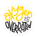Dye cut motivational decal with 'Oxygen is Overrated' text in yellow, gray, and black on a white background