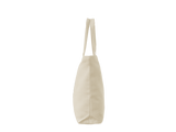 A plain canvas tote bag in a light cream or off-white color, shown from the side against a solid white background.