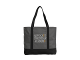 A gray tote bag with black handles and a black bottom panel, featuring the text 'ADVOCATE CHRISTIAN ACADEMY' printed on the front in white and gold.